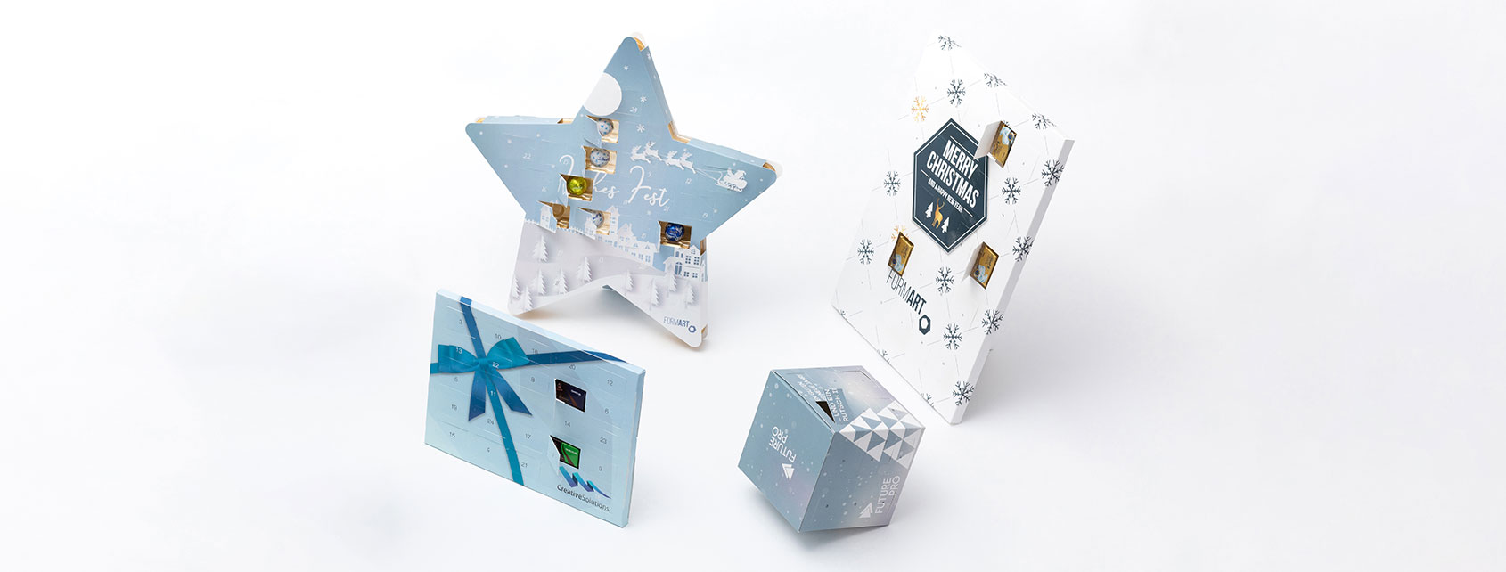Vier Adventskalender in unterschiedlichen Formen und Designs